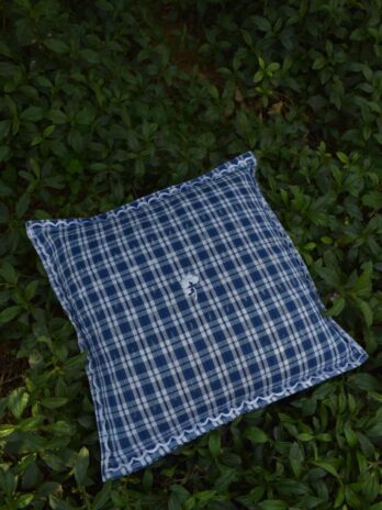 Ikat blue check cushion – single flower